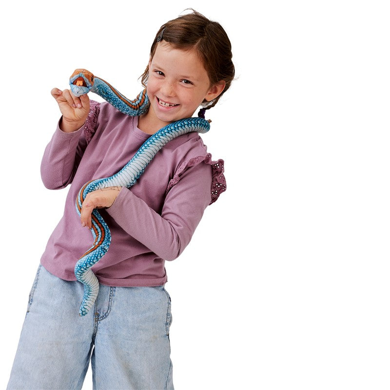 Child playing with a colorful San Francisco Garter Snake Puppet made of soft fabric with movable mouth and weighted body.