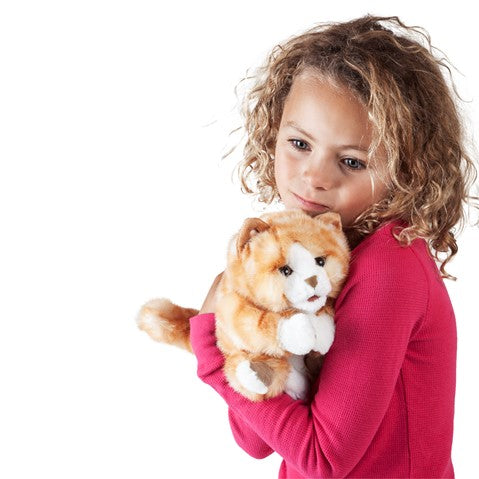 Child holding a soft Kitten Orange Tabby Puppet with striped fur and wiggly whiskers in a cozy hug.