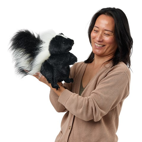 Standing Skunk Puppet held by a smiling woman
