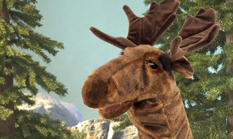 Moose Stage Puppet with expressive eyes and movable mouth, set against a forest background for imaginative storytelling.