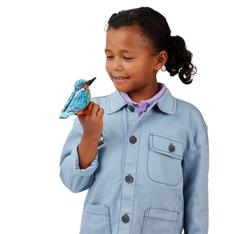 Child smiling while wearing a Common Kingfisher Finger Puppet on hand, showing the colorful bird design.