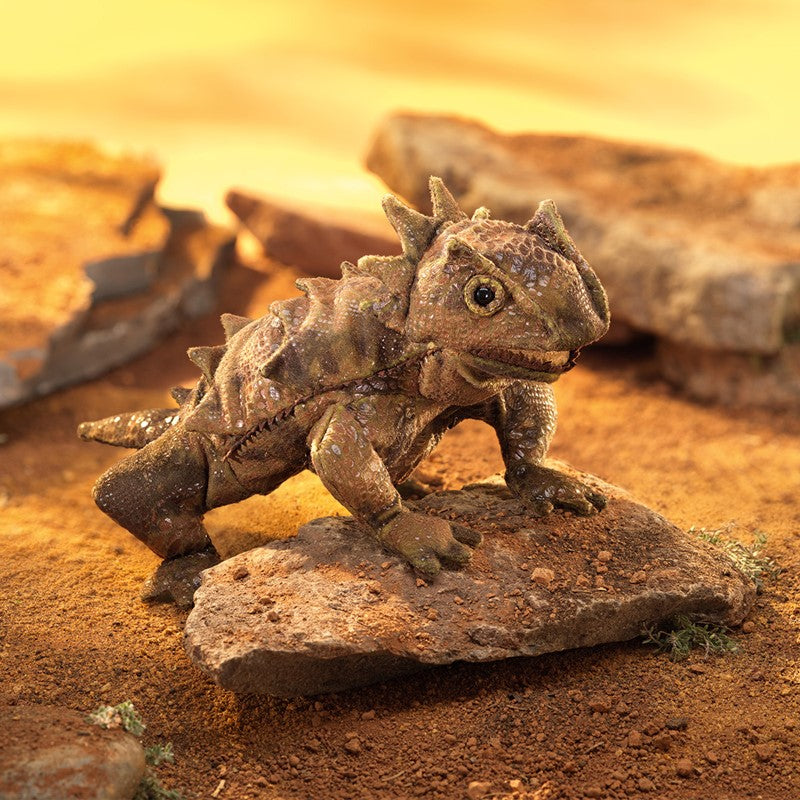 Horned Lizard Puppet with realistic horns and textured body, posed on a desert rock for lifelike reptile play.