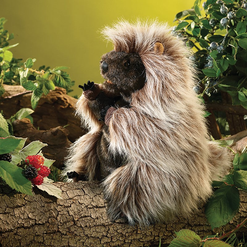 Standing Porcupine Puppet perched on a log in a woodland scene