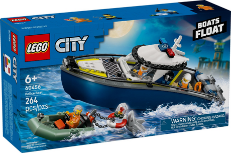 LEGO City police boat chasing a crook in a small dinghy with minifigures and a shark in the water below.