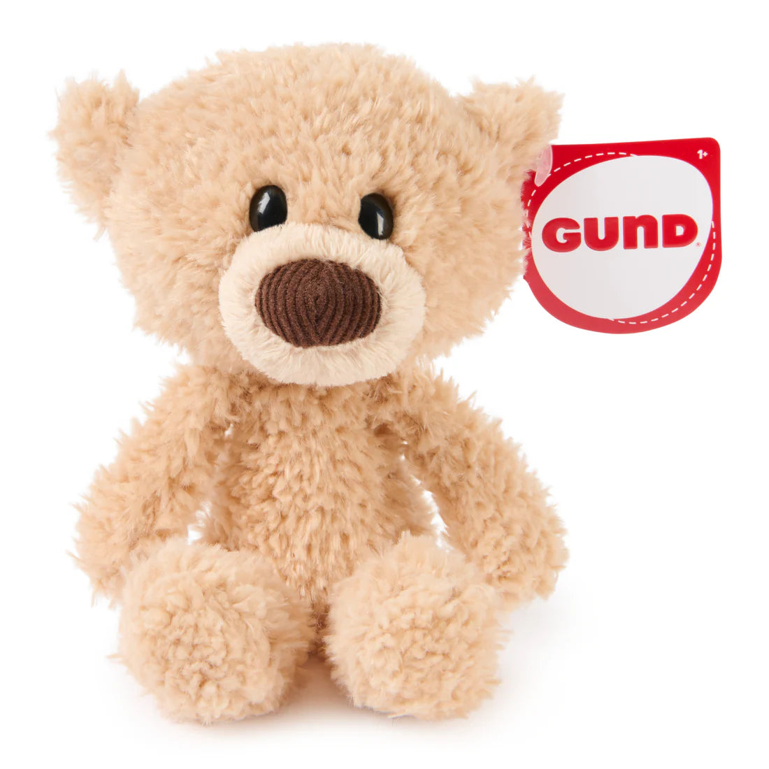Small beige plush bear with soft fur and a fabric tag labeled GUND sitting against a white background