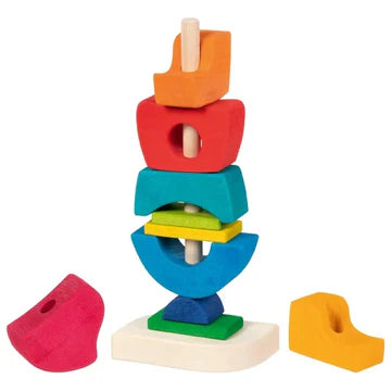 Colorful wooden stacking castle blocks in different shapes arranged on a vertical rod on a white base for creative play.