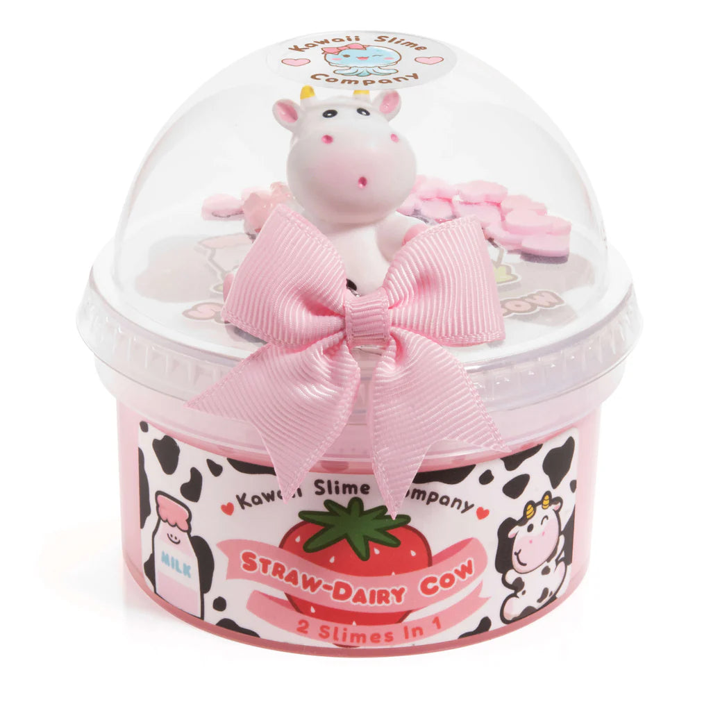 Straw-Dairy Cow 2 Slimes in 1 with pink bow, cow topper, and strawberry milk design in clear dome packaging.