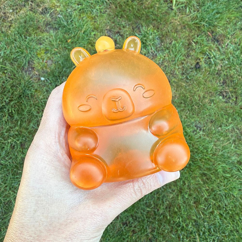 Super Duper Sugar Squisher | Capybara orange squishy toy held in hand