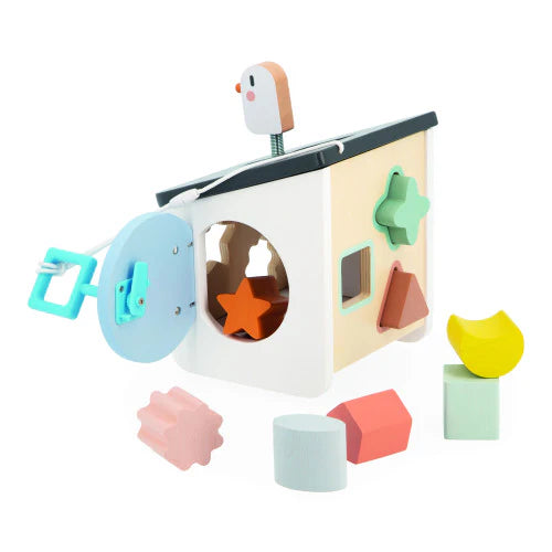 Sweet Cocoon Bird House Shape Sorter wooden toy with colorful slot-in shapes and a spring-loaded bird on roof.