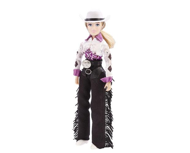 Taylor Cowgirl doll dressed in Western show shirt, hat, belt buckle, and fringed chaps, 8-inch articulated figure.
