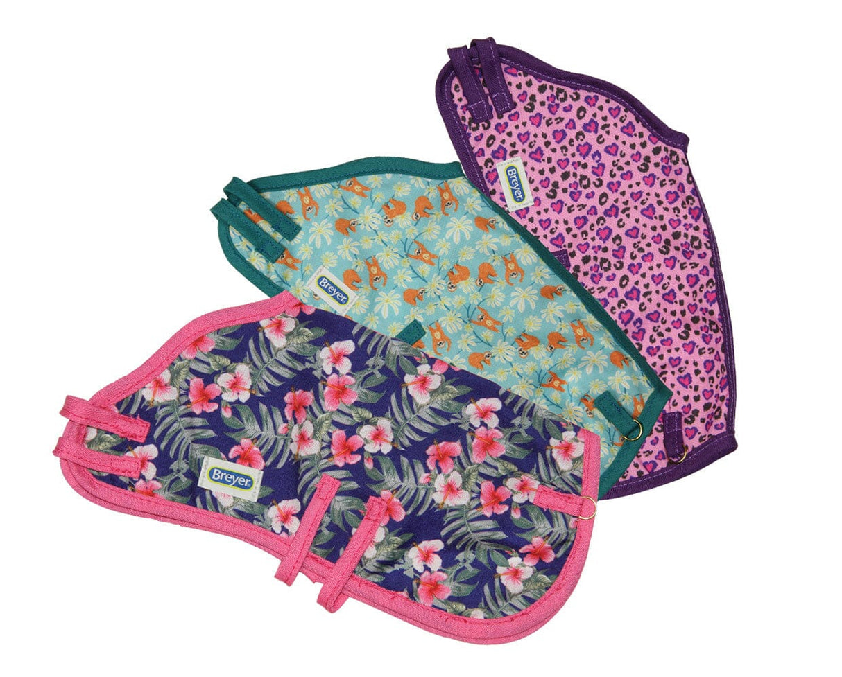 Colorful Blanket featuring floral, flamingo, and leopard patterns with bright colored trim for fun and cozy use.