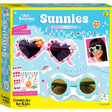 Chic Boutique Sunnies DIY kit with flower and heart-shaped sunglasses, rhinestones, pearls, and charms for kids.