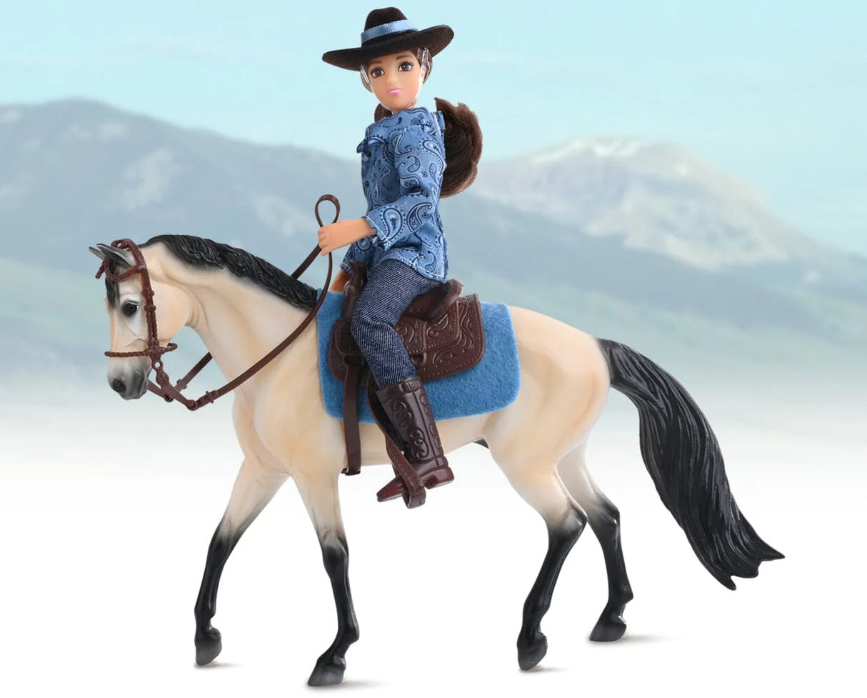 Western Horse & Rider toy with articulated figure, buckskin horse, Western saddle, and bridle in scenic outdoor setting