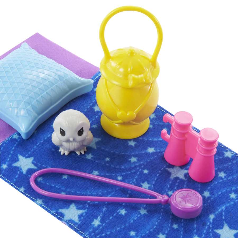 Barbie Chelsea Camping playset accessories including pillow, baby owl, lantern, binoculars, and compass on star-printed mat.