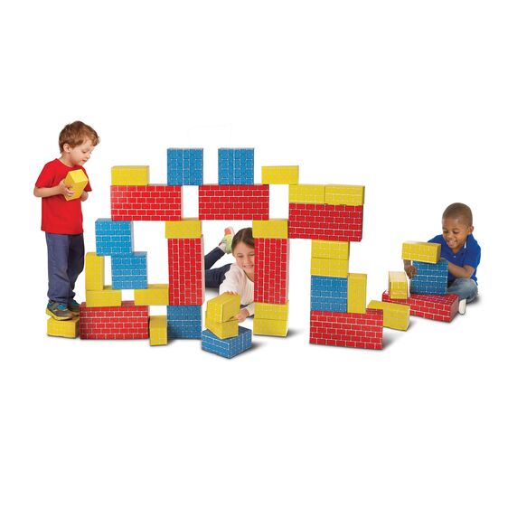Children playing with colorful Deluxe Jumbo Cardboard Blocks building a large structure together.