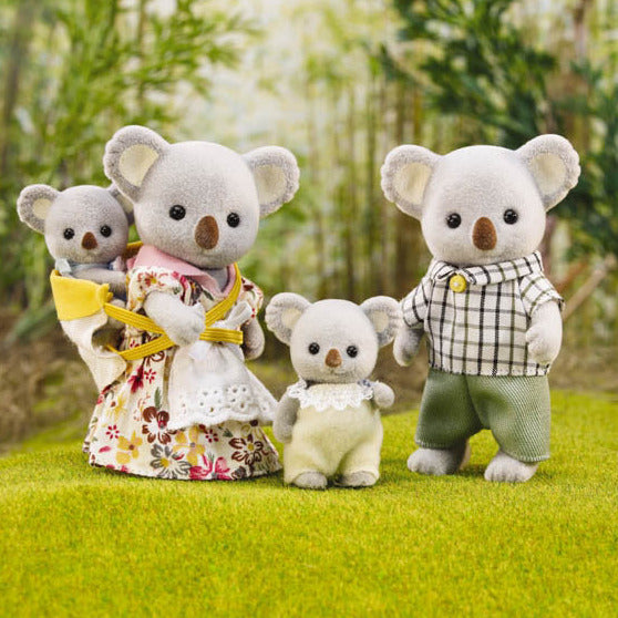 Koala Family featuring mother, father, sister, and baby koalas in detailed removable clothing on grassy backdrop.