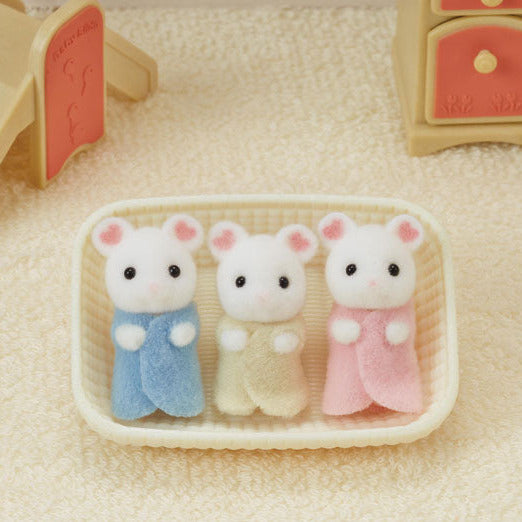 Marshmallow Mouse Triplets featuring three cradled babies in blue, yellow, and pink fabric clothing in a small cradle.
