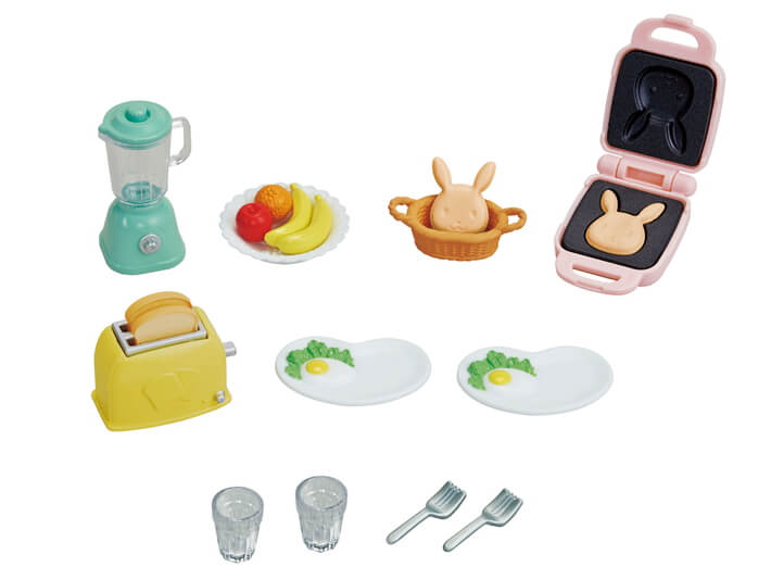 Breakfast Playset with toaster, blender, plates with eggs, fruit, bunny bread, cups, and forks for imaginative play.