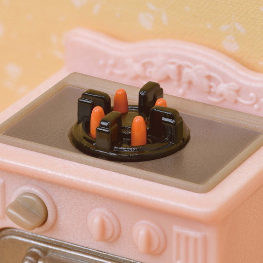 Close-up of hob knob on Playful Furniture starter set with flame detail for interactive pretend play.