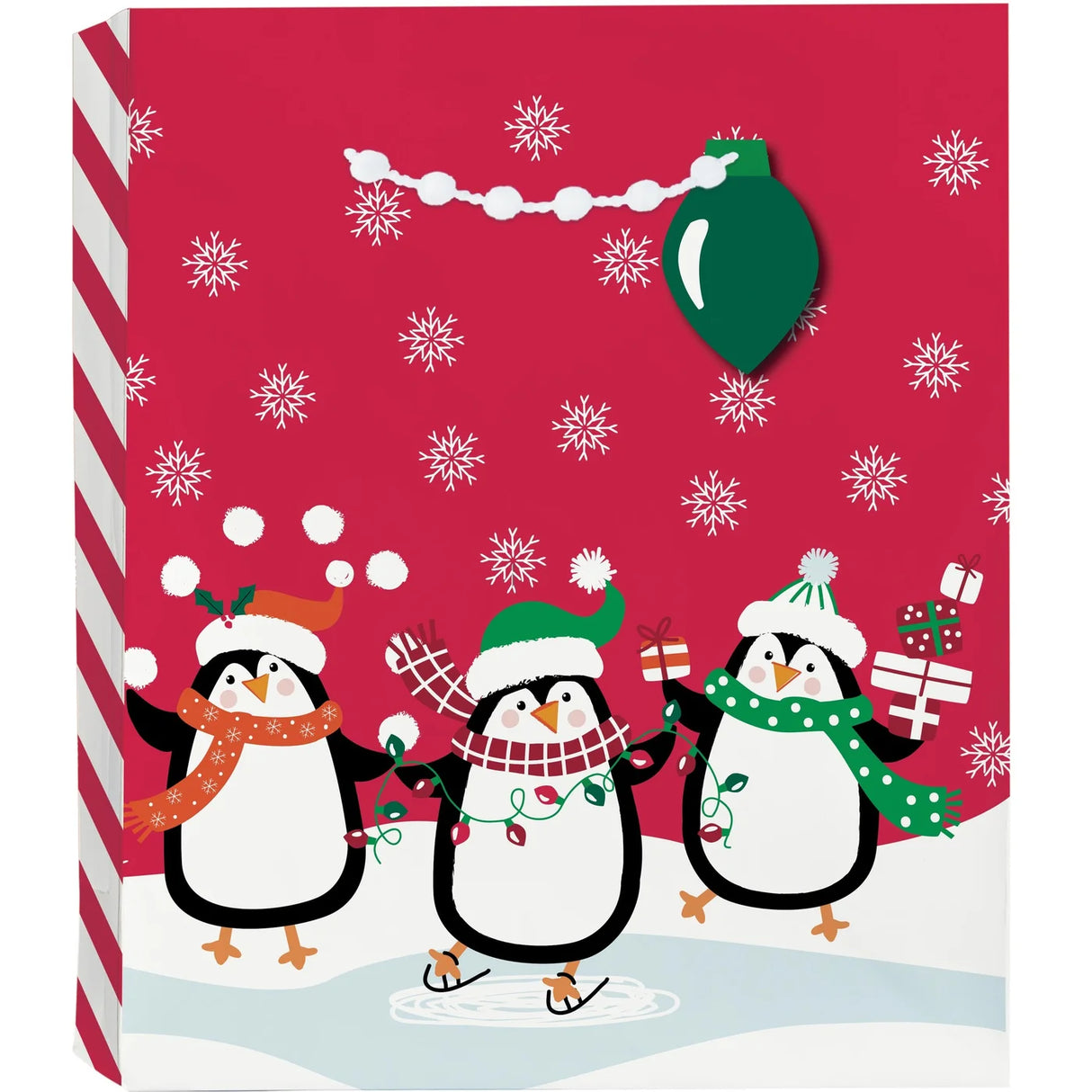 Gift Bag Large North Pole Characters with playful penguins ice skating, snowflakes, white pom-pom handles, and Christmas-light hang tag.