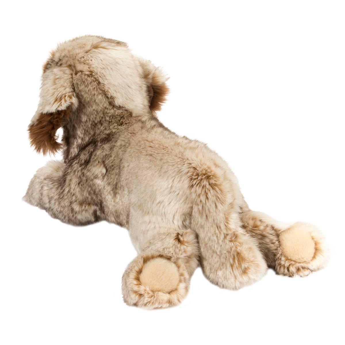 Leonberger Thor plush toy lying down with soft, fluffy fur and bean-filled floppy paws in natural colors.
