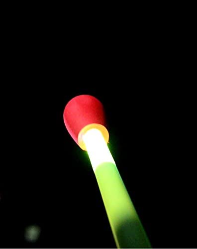 Stomp Rocket Ultra LED showing a brightly glowing foam-tipped rocket illuminated in the dark sky for outdoor play.