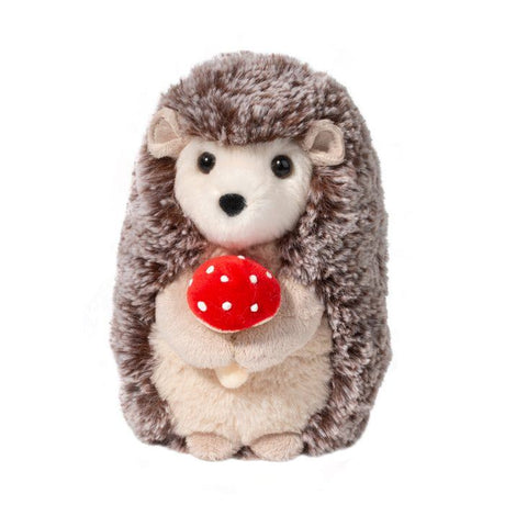 Hedgehog Stuey plush toy holding a red mushroom with soft brown and cream fur and shiny black eyes.
