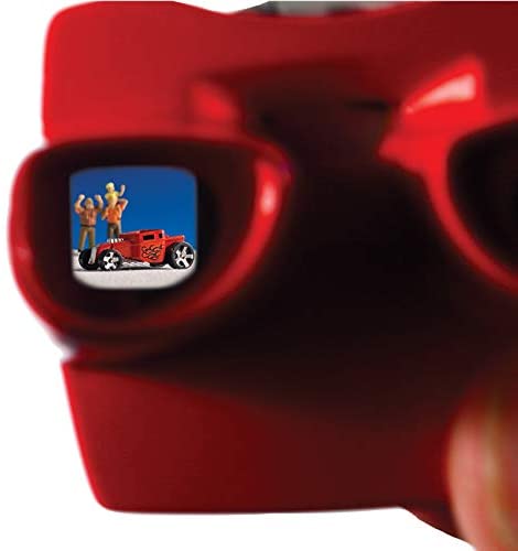 Close-up of the red World’s Smallest Viewmaster showing a miniature car and figures on its image reel.