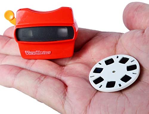 World's Smallest Viewmaster shown in hand with red retro design and 7-image reel, a mini version of the classic toy.