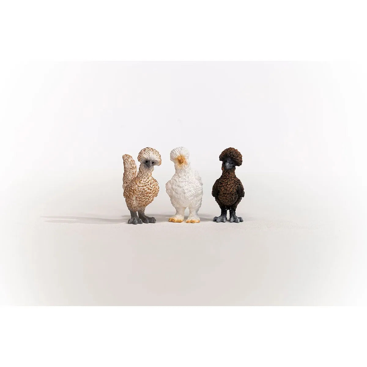 Chicken Friends set featuring three detailed Polish and Silkie chicken figures standing side by side on a white background.