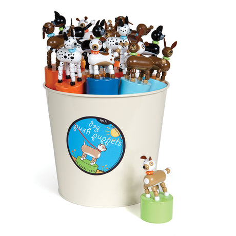 ThumbToy Dog push puppets in assorted colors displayed in a bucket with one on a green base.