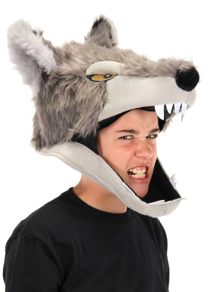 Person wearing a gray faux fur Wolf Jawesome Hat with gold eyes and felt teeth open wide.