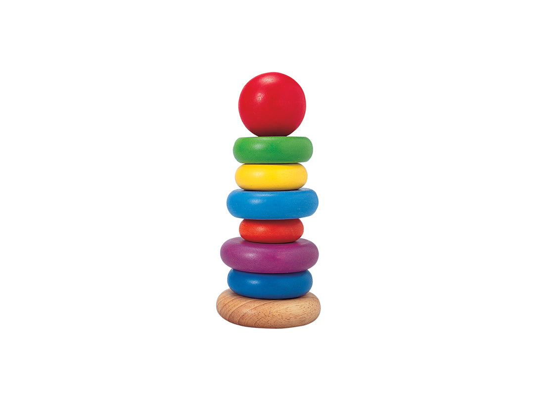 Stacking Ring toy with colorful wooden rings in varying sizes stacked on a natural wood base for children's play.