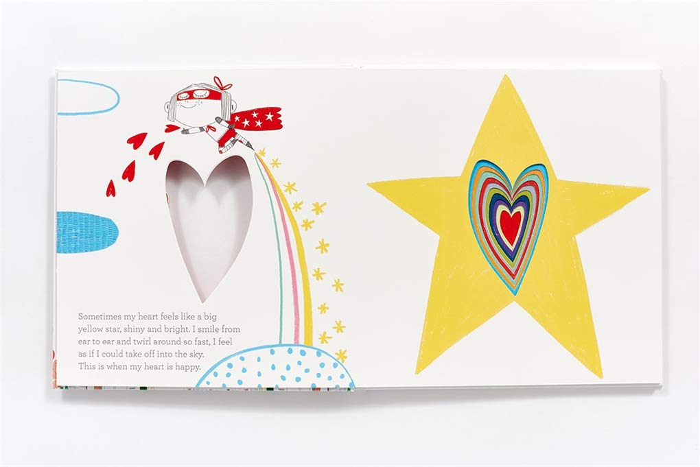 Open spread of In My Heart showing colorful heart cutout and whimsical illustrations expressing emotions.