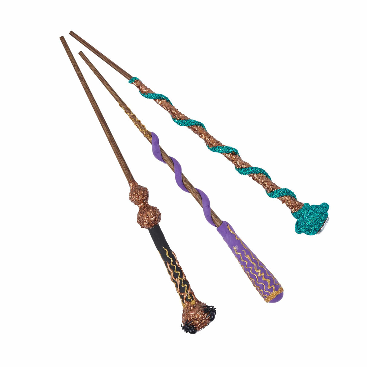 Magic Wand Kit | Spellbound showing three decorated wooden magic wands with glitter and colorful designs.