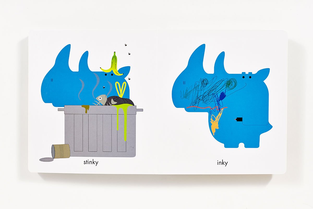 Rhymoceros book showing a blue rhino illustrating rhyming words “stinky” and “inky” with playful artwork for kids ages 2-5.