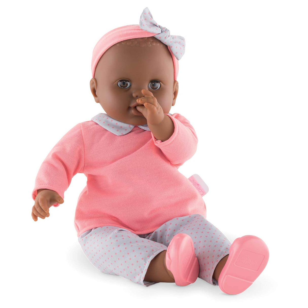 Grand Poupon Lilou baby doll with vanilla-scented vinyl, dressed in pink outfit, perfect for cuddling and play.