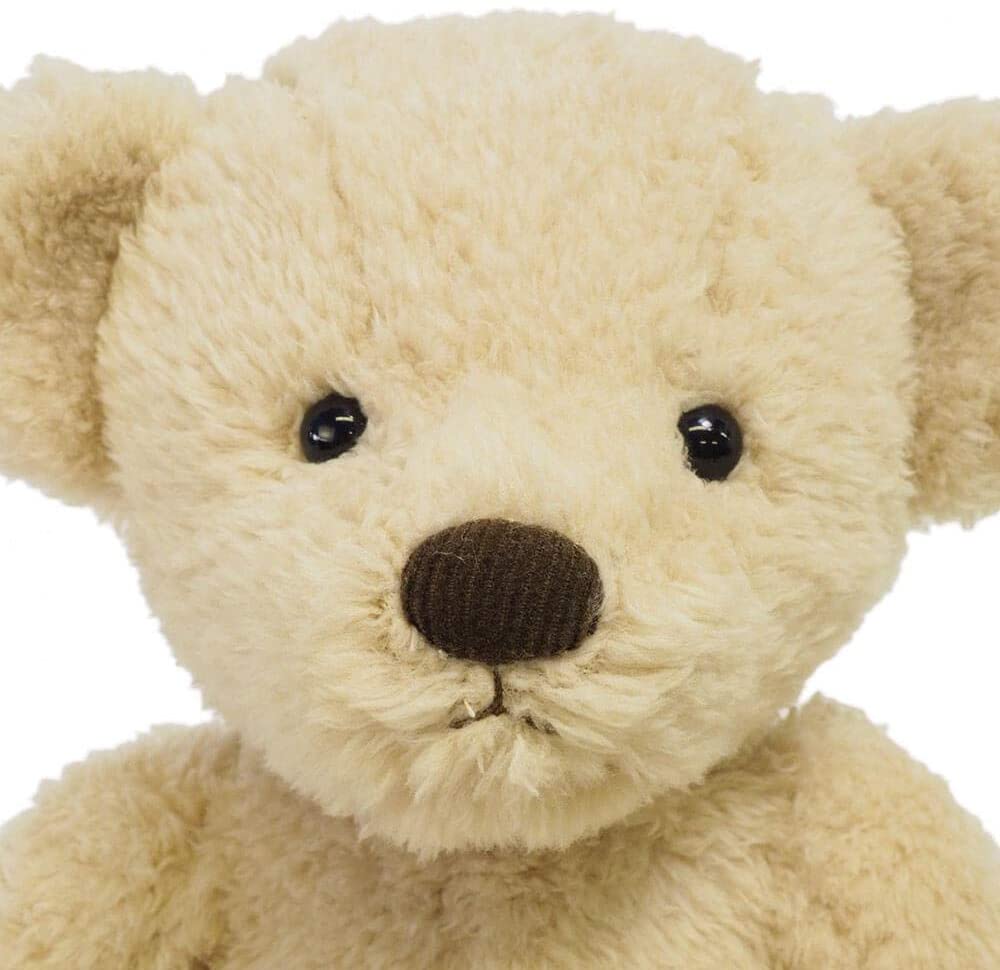 Close-up of the soft beige plush Teddy Bear Cindy with vintage-style sewn limbs and a huggable texture.
