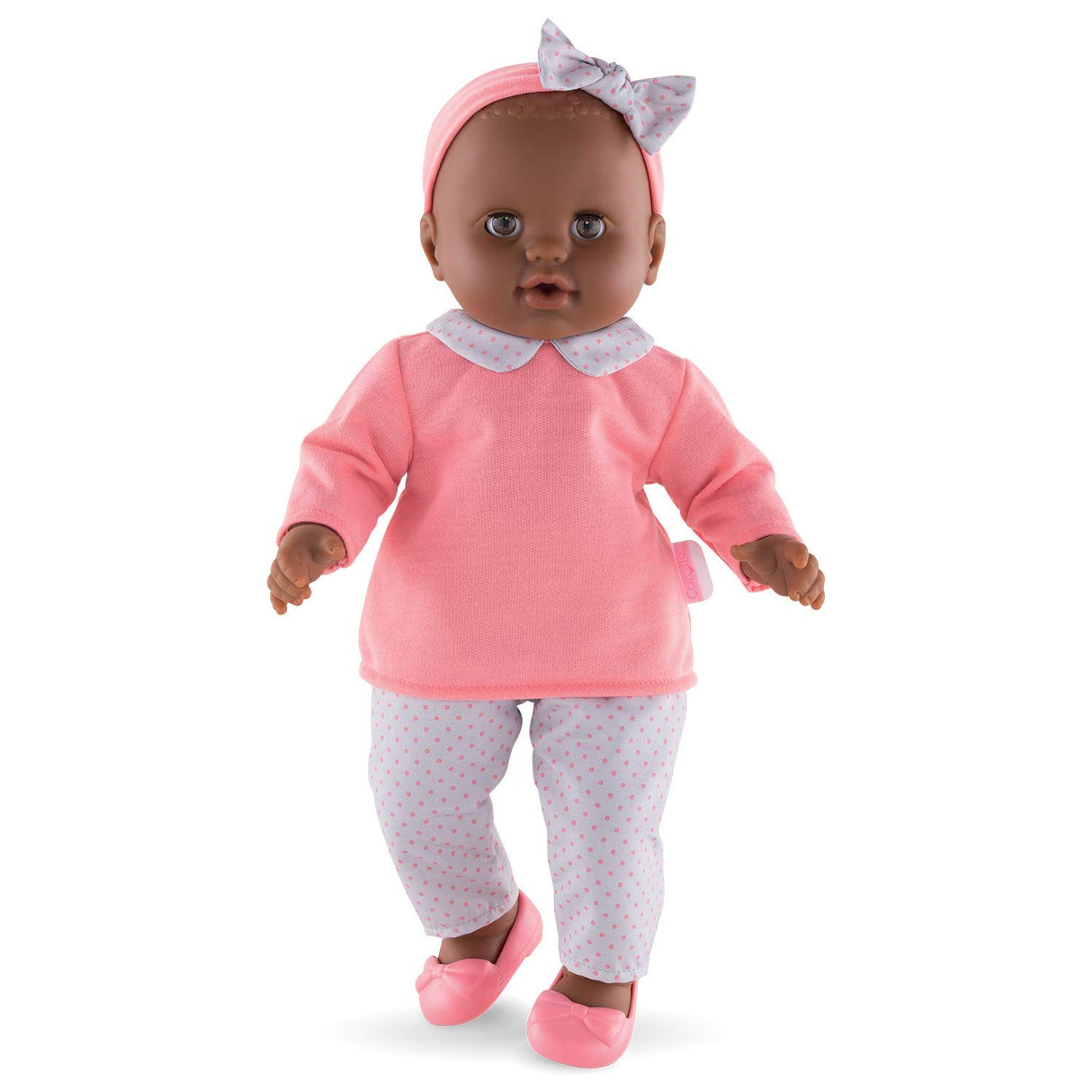Grand Poupon Lilou doll dressed in pink top, polka dot pants, headband, and ballet flats, perfect for cuddling.