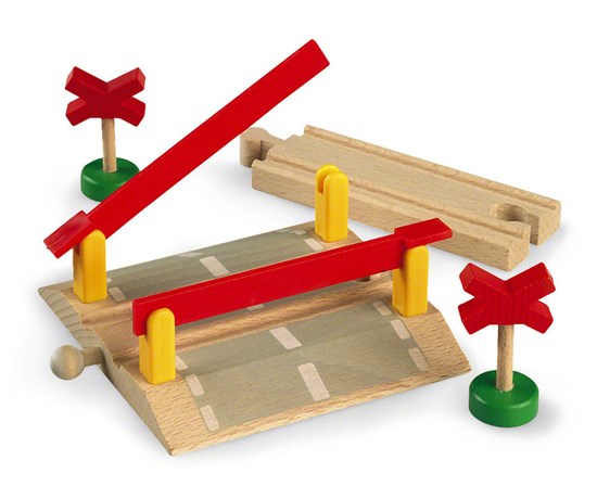 Railway Crossing toy with wooden barriers and warning signs for BRIO train tracks, designed for children ages 3 and up.