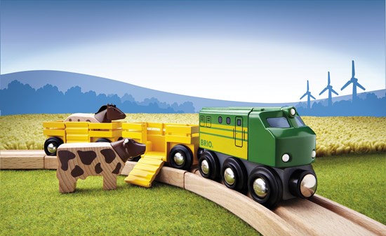 Farm Train toy with green engine, yellow wagons, wooden horse and cow ready to board on curved wooden track.