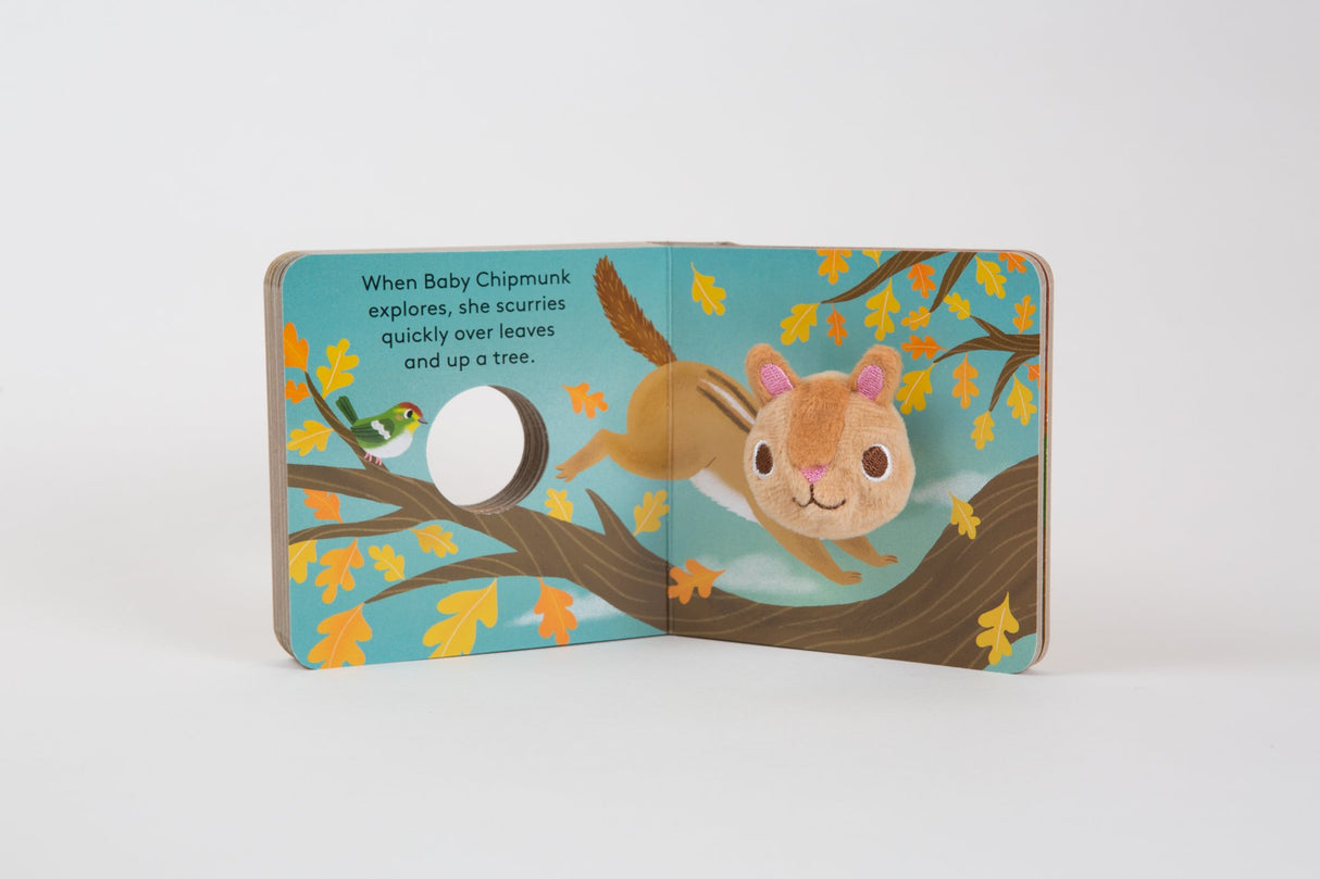Baby Chipmunk with Finger Puppet board book open showing plush chipmunk puppet climbing a tree branch.