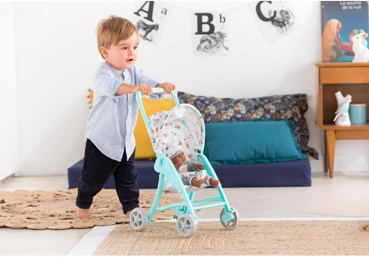 Child pushing a baby doll stroller with folding canopy and adjustable belt, Stroller Mint by Corolle Mon premier poupon.