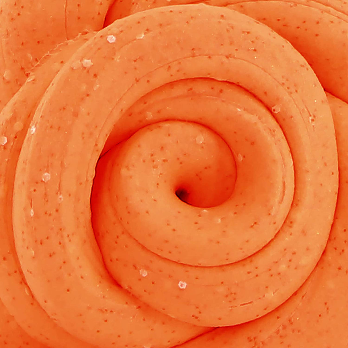 Close-up of bright orange swirled SCENTsory Orangesicle Thinking Putty with white and orange speckles and a smooth texture.
