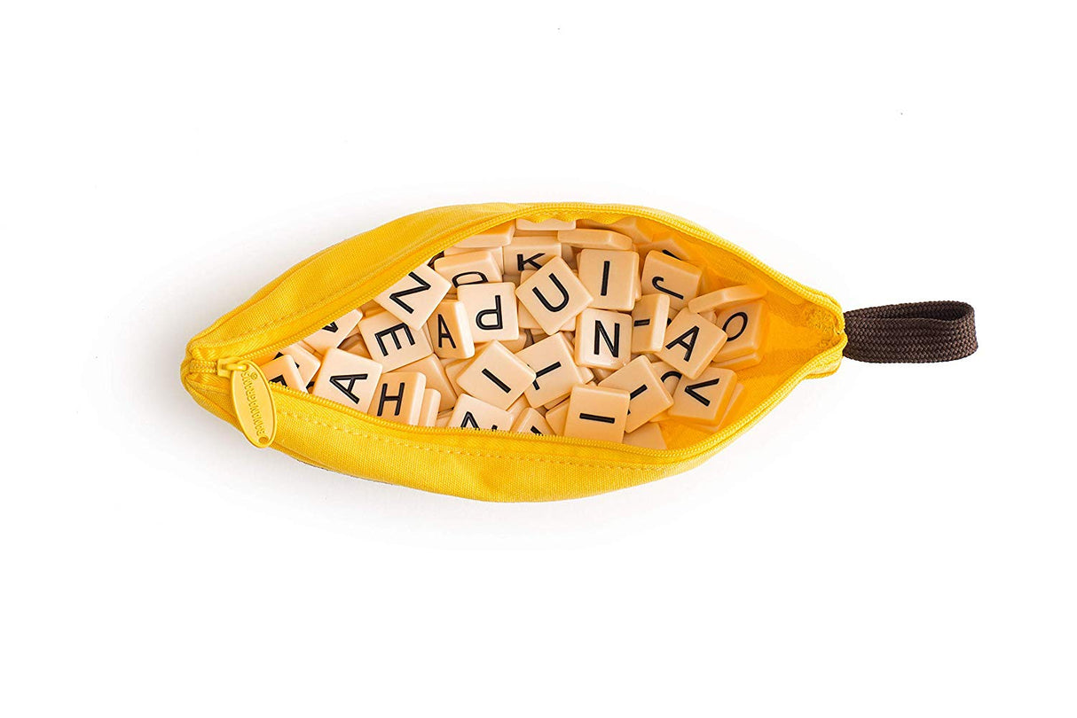 Bananagrams yellow banana-shaped pouch open showing scattered letter tiles for the word game travel edition.