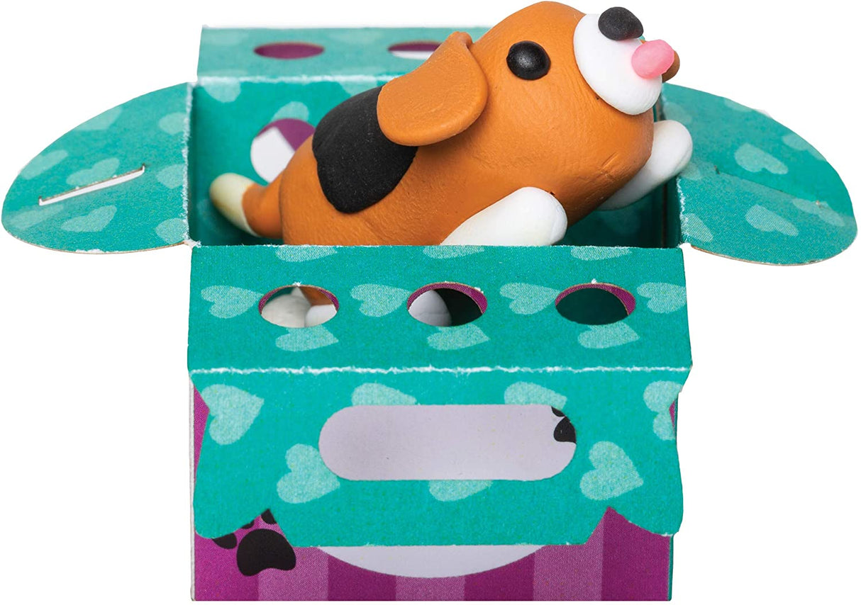 Mini Clay World Pet Adoption Truck with a handmade clay dog figure in a colorful papercraft pet carrier box.