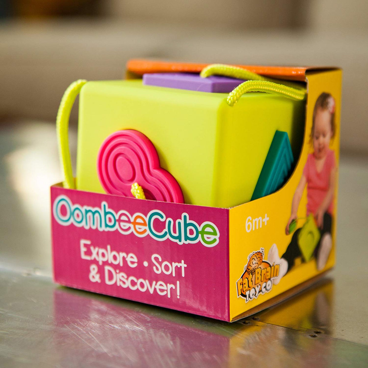 OombeeCube sensory toy with six colorful textured shapes for tactile exploration and fine motor skill development.