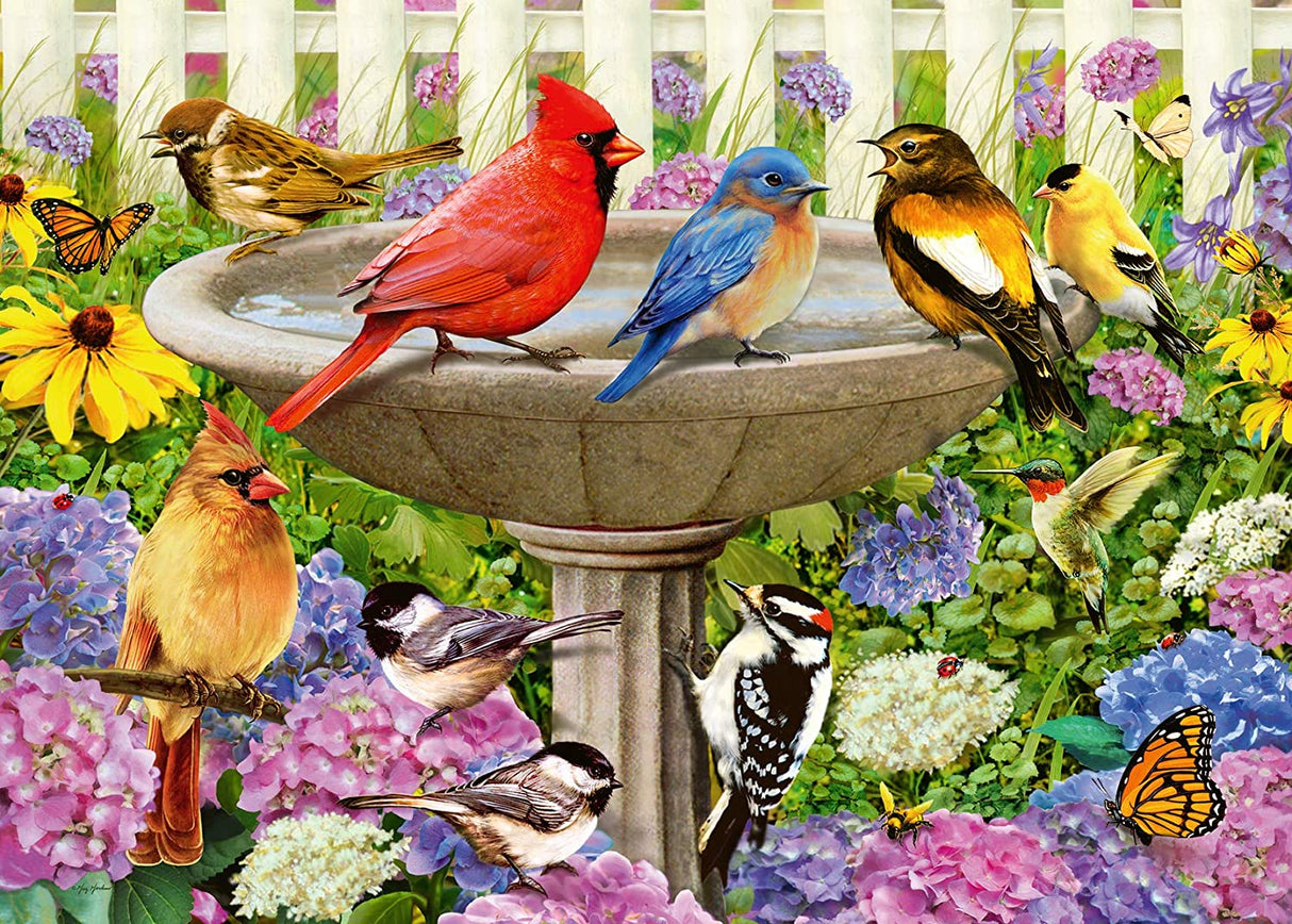 500pc Large Format At the Birdbath Puzzle with colorful birds and vibrant flowers around a stone birdbath.