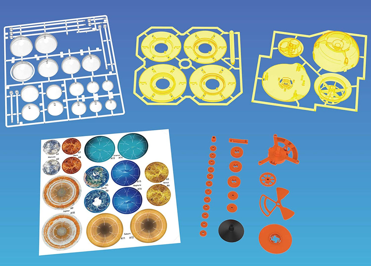 Orbiting Solar System mechanical model parts including colorful planet graphics and gears ready for assembly and motion.