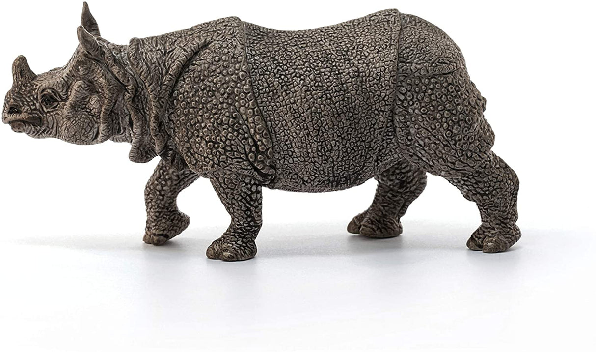 Rhinoceros figurine showing thick armor-like skin folds in detailed realistic texture and calm posture.
